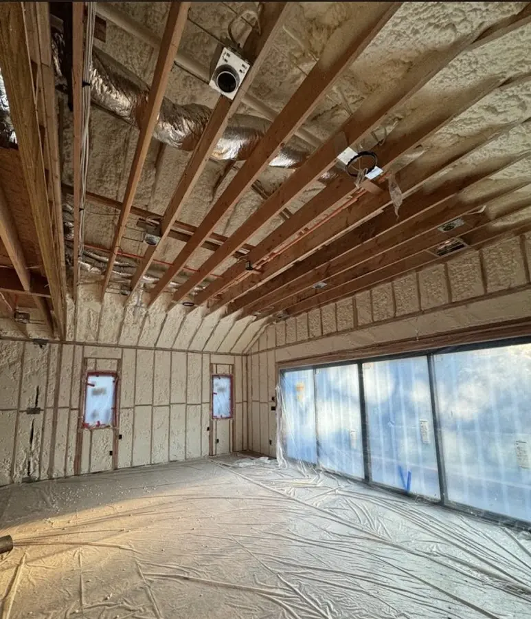 Interior walls and ceiling insulated with spray foam during new construction in Lake Jackson